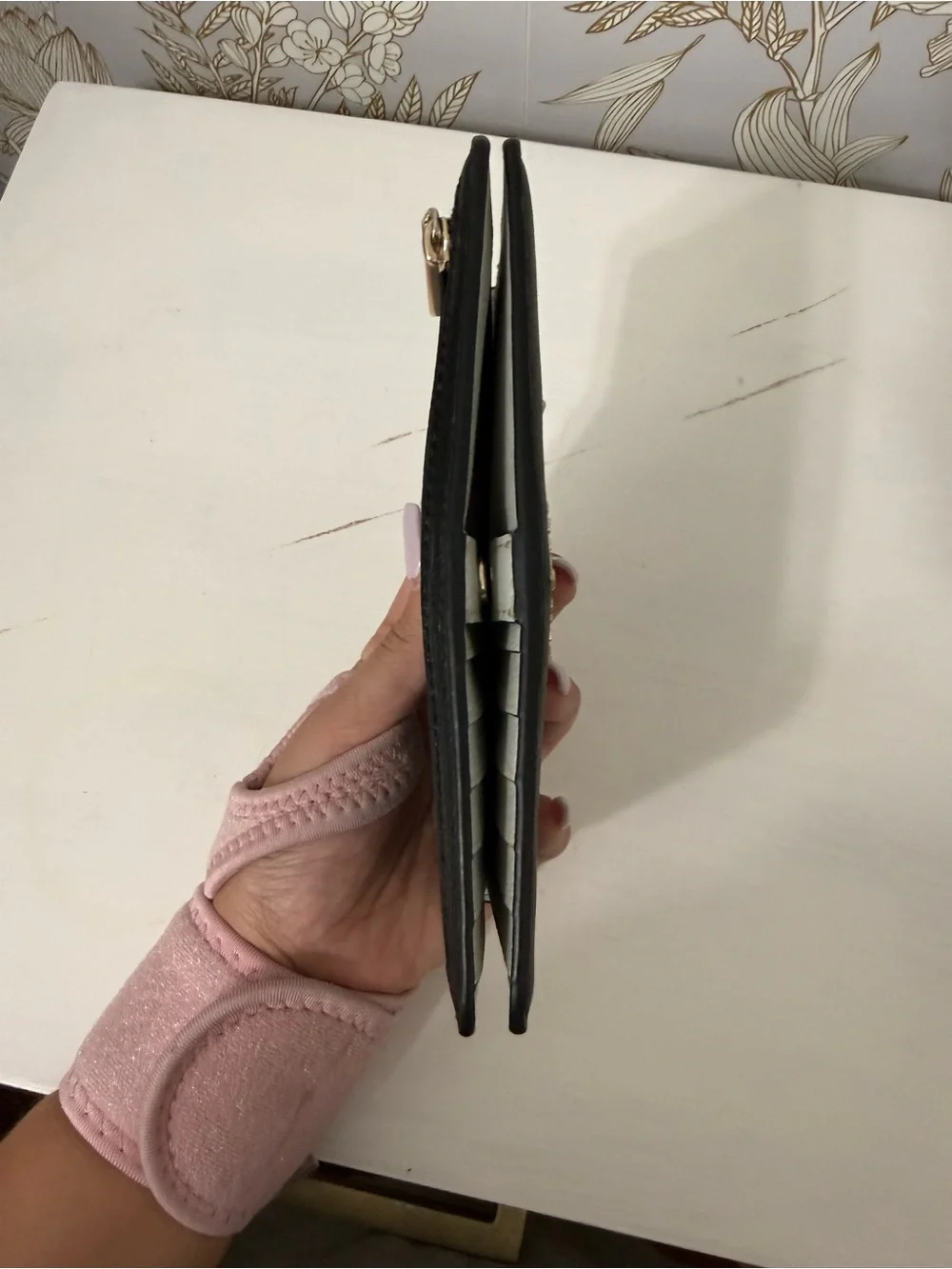kate spade black leather zip-around continental wallet with gold logo